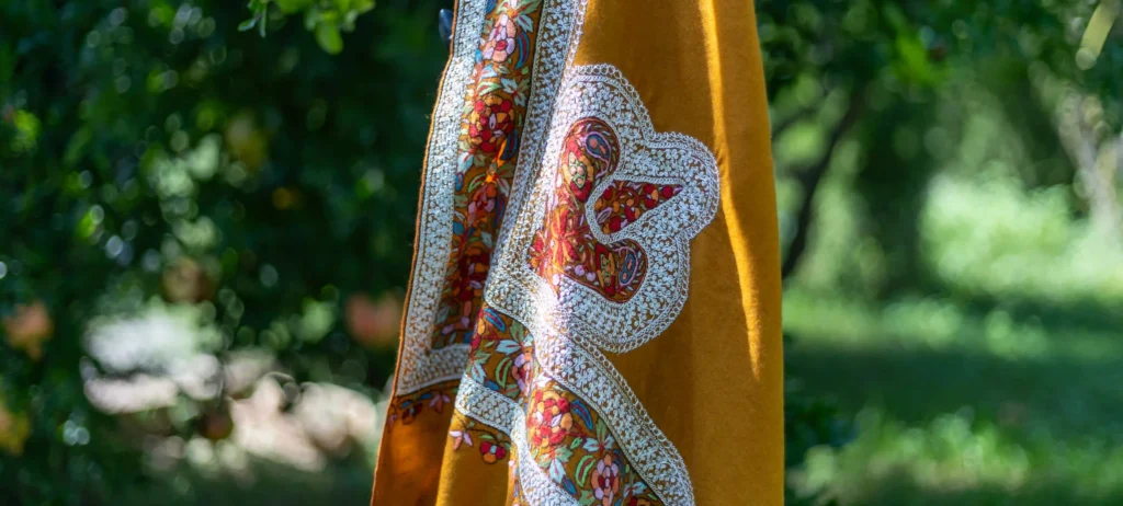zari and sozni work on mustard pashmina shawl in kashmir